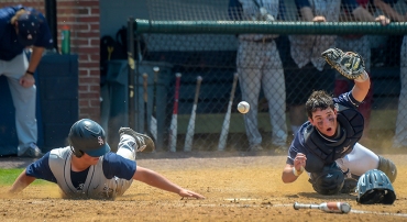 Baserunner Chase Verdery(8) of St. Albans collides with Georgetown Prep catcher Max Kaye(12) to score in the second inning of play during the IAC championship baseball game in Bethesda, MD on May 12, 2018. (Photo by Will Newton for The Washington Post)