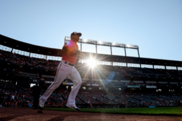 BALTIMORE, MD - JULY 13: Rio Ruiz #14 of the Baltimore Orioles runs on to the field prior to game two of a doubleheader against the Tampa Bay Rays at Oriole Park at Camden Yards on July 13, 2019 in Baltimore, Maryland. (Photo by Will Newton/Getty Images)